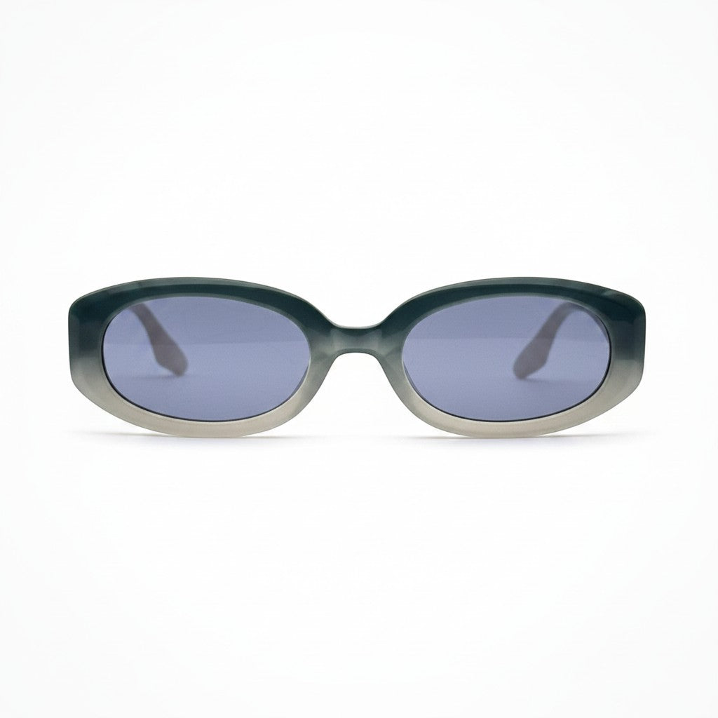 Moodi Alice gafas de sol ovaladas de acetato con lentes tintadas azules y montura degradada gris y blanca.