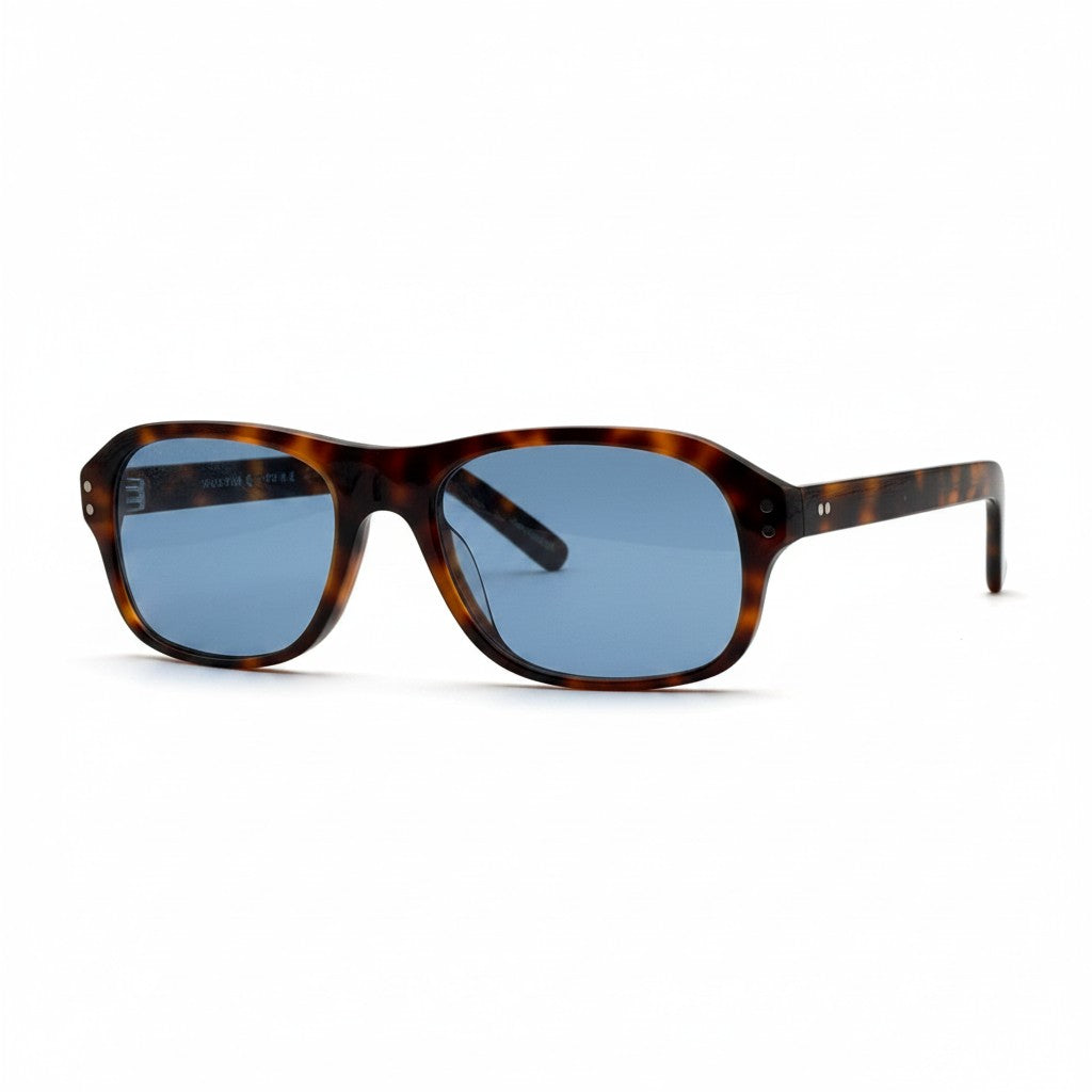 Gafas de sol Moodi Zylo con montura carey y lentes polarizadas azules. Forma rectangular redondeada.