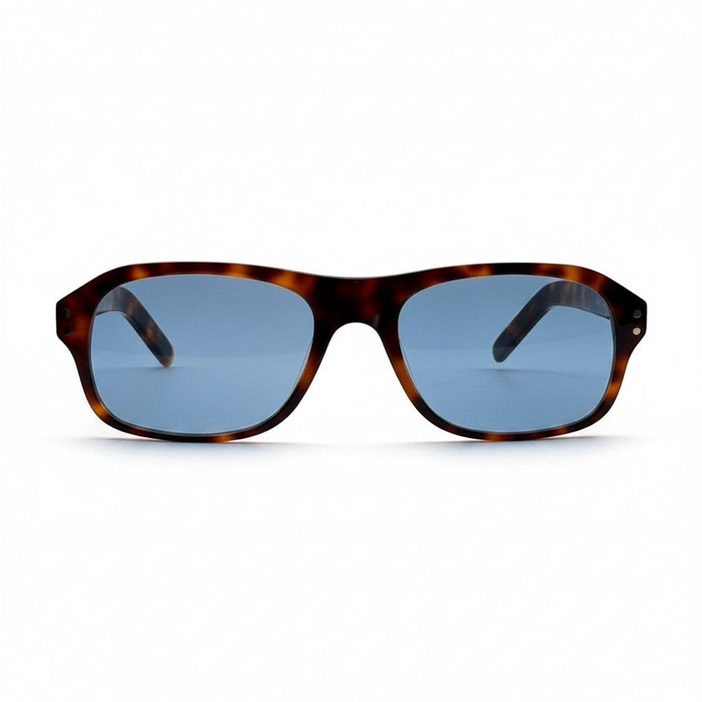 Gafas de sol Moodi Zylo con montura carey y lentes polarizadas azules. Forma rectangular redondeada.