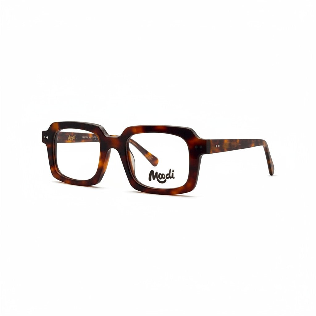 Gafas de pasta Moodi modelo Hopper con montura gruesa de carey y logo en la lente.