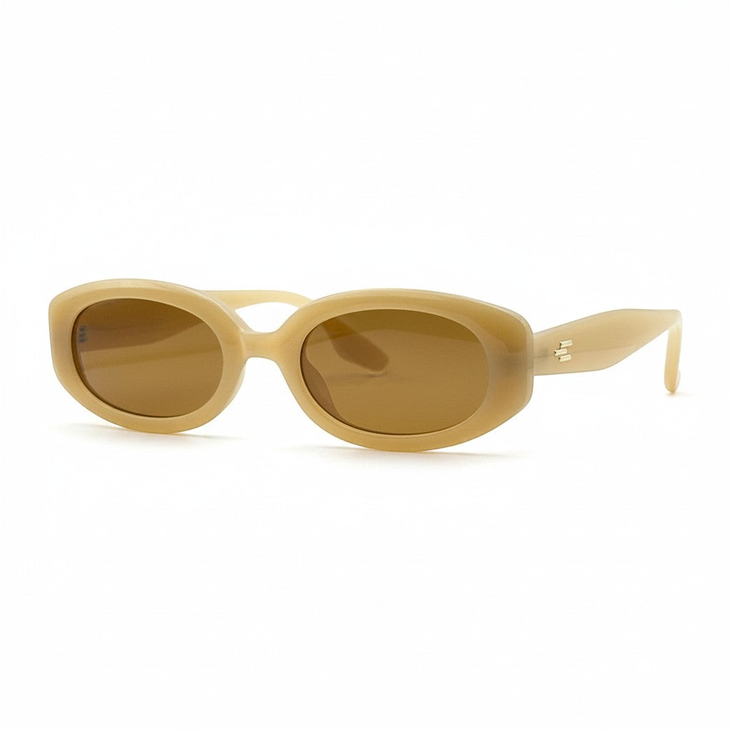 Gafas de sol Moodi Alice de acetato beige cálido con montura ovalada y lentes tintadas marrones. Protección UV400.